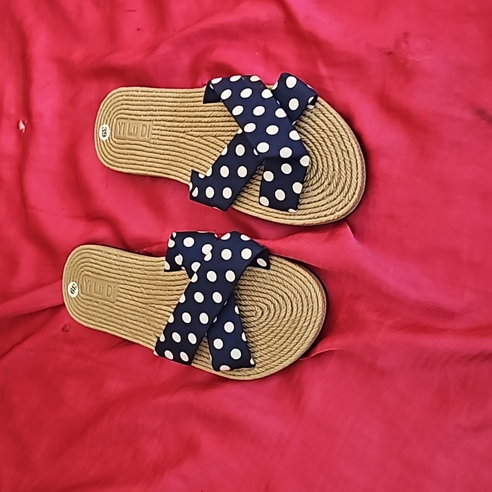 Brand new sandals with a very dark navy and white polka dots.